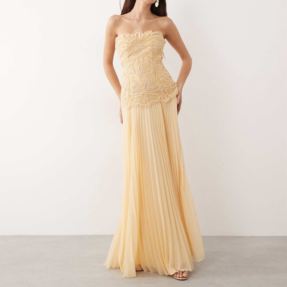 ARRANGE abstract cutwork strapless maxi dress with pleated skirt in buttermilk